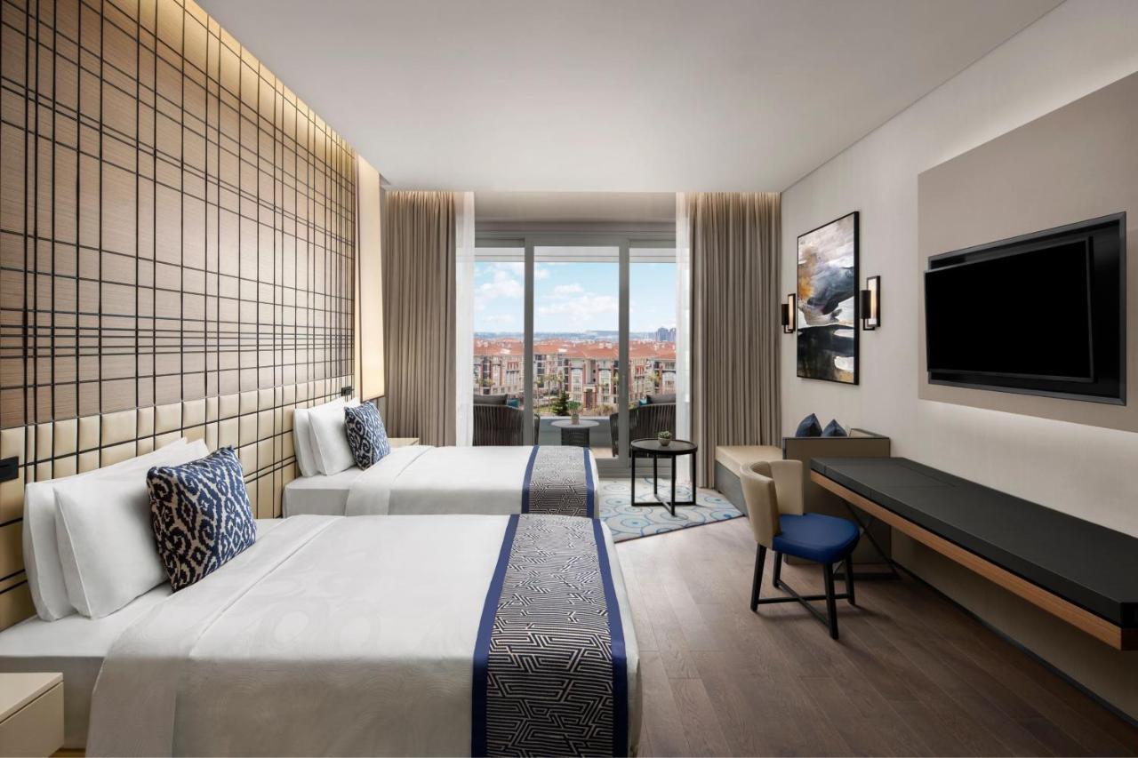 Deluxe Zimmer mit 2 Einzelbetten, Schlafsofa, Balkon und Stadtblick
