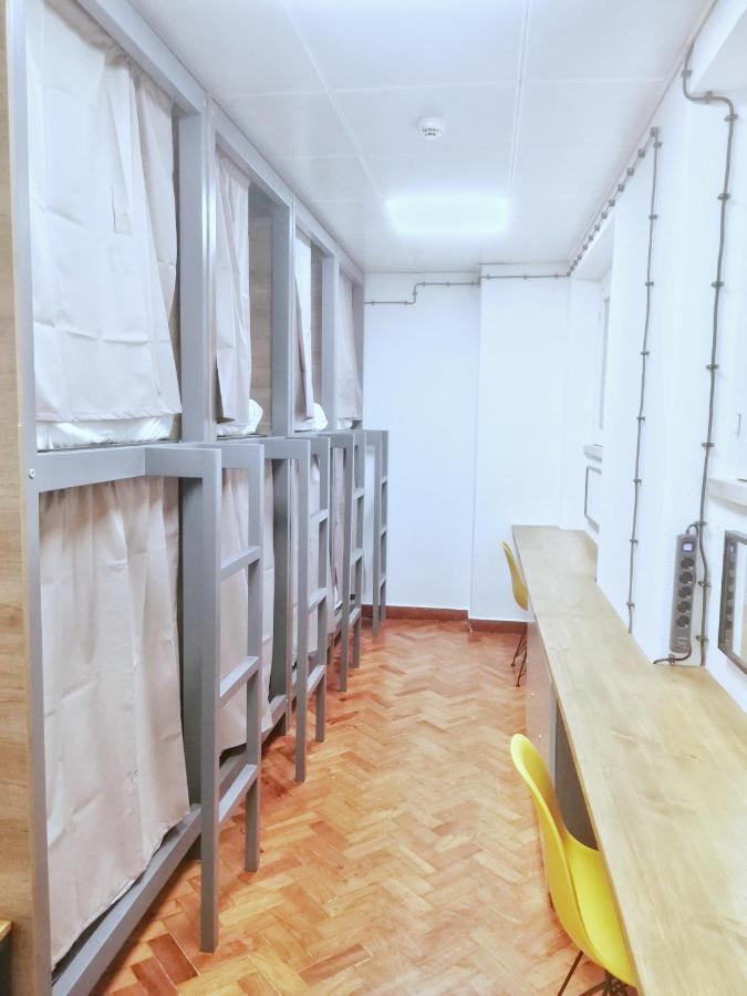 Cama en habitación compartida de 8 camas